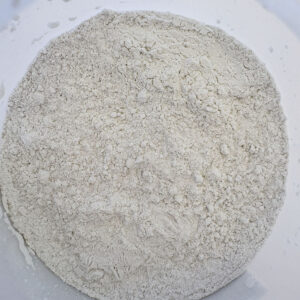 Raw material sample of BT-382 organoclay rheological additive powder in a container