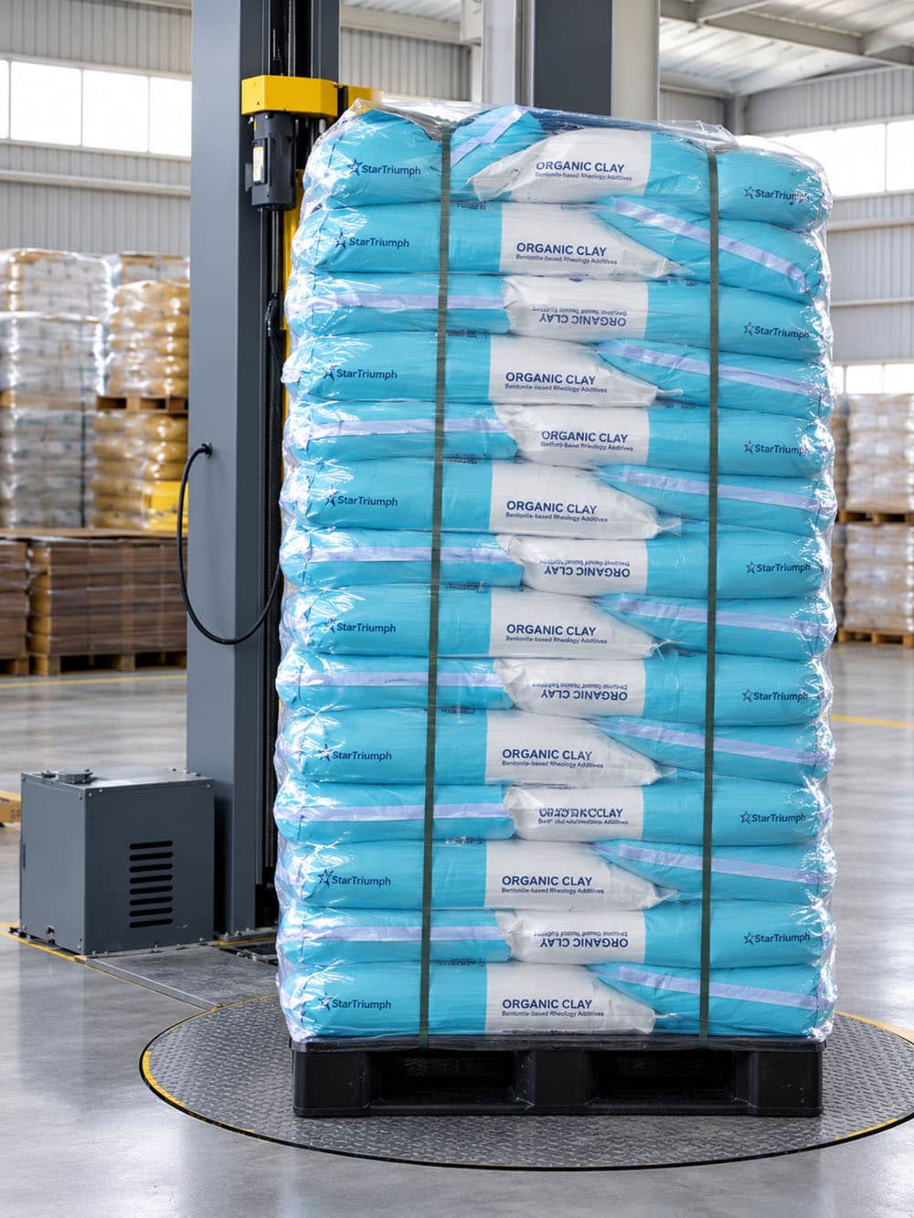Organic bentonite bags palletized and wrapped with protective stretch film for storage and shipment